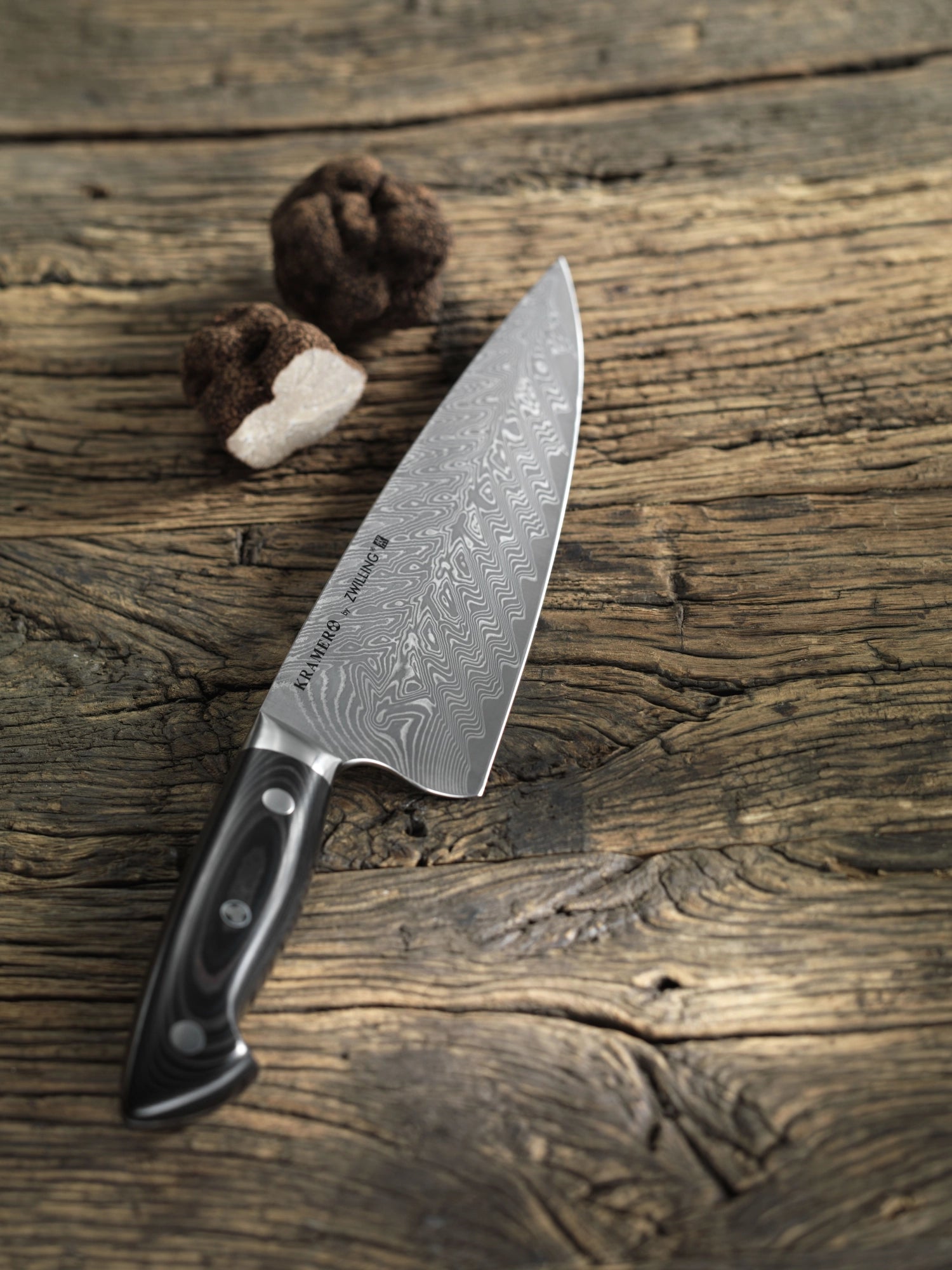 Kramer Euro Stainless Kochmesser 26 cm von Zwilling, perfekt für präzise Schnitte und vielseitige Einsatzmöglichkeiten in der Küche.