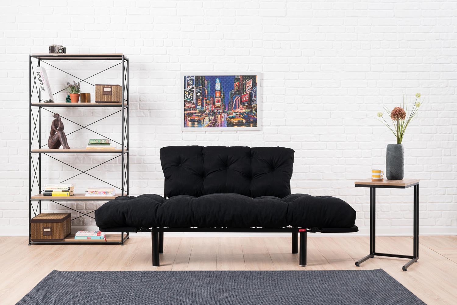 Stylisches Nitta Bettsofa in elegantem Schwarz, perfekt für gemütliche Nächte und stilvolle Wohnräume.