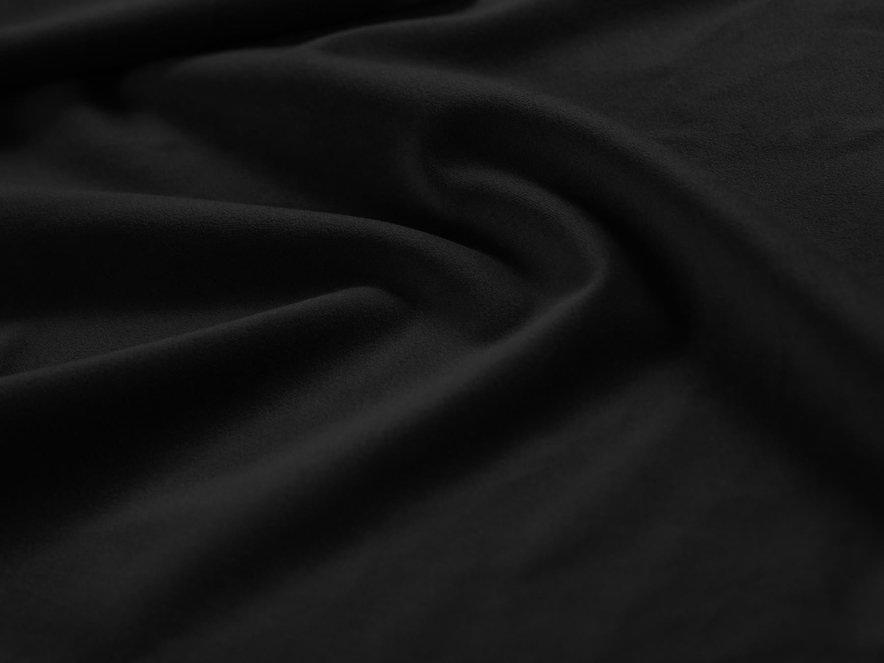 Eleganter 1-Sitzer Pouf Treno in modernem Black-Bluvel, ideal für stilvolle Wohnräume. Hochwertige Verarbeitung von Cosmopolitan Design.