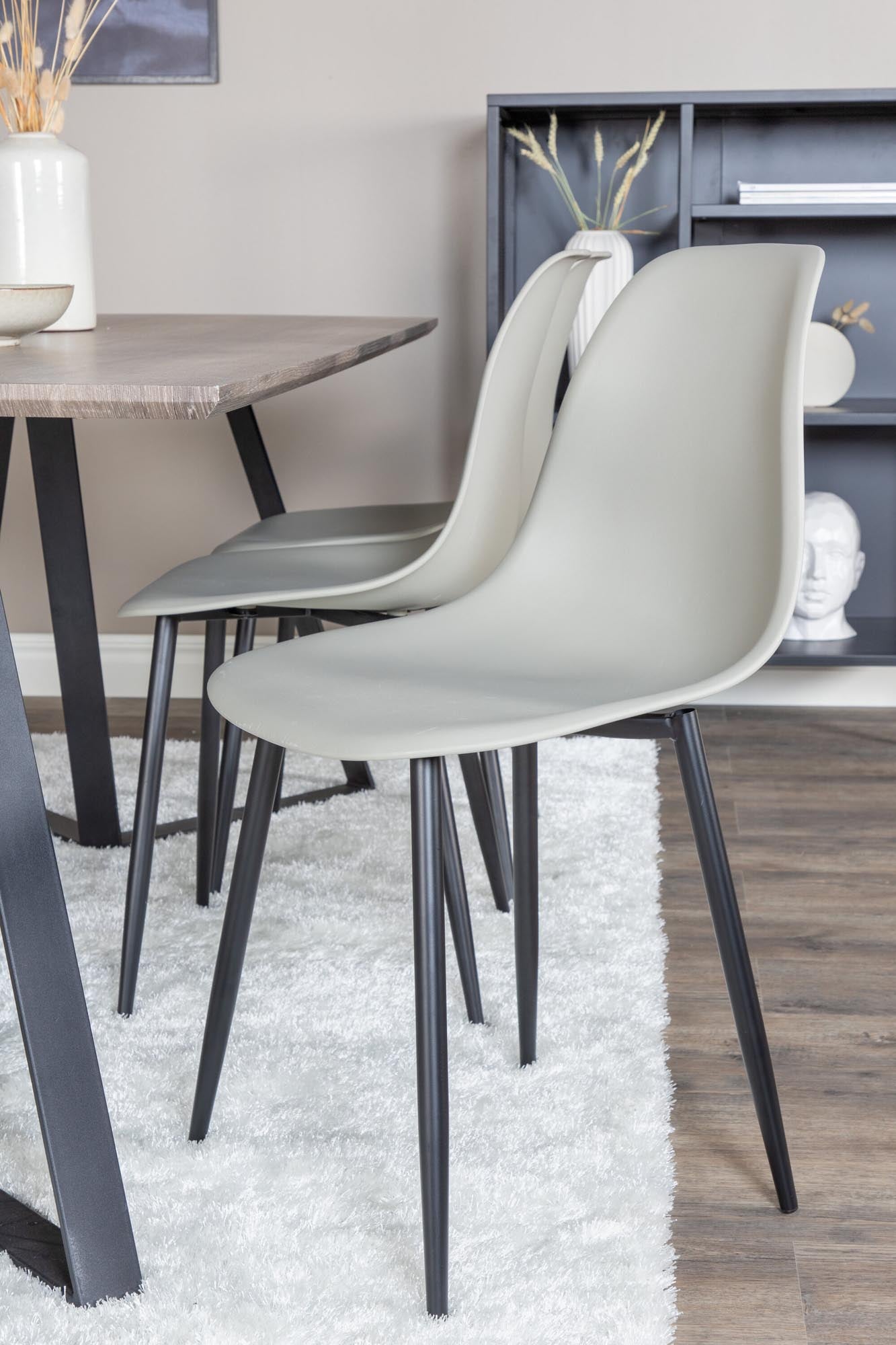 Stilvolles Esszimmerset aus robustem Polar Plastic, bestehend aus einem 180 cm langen Tisch und 6 passenden Stühlen, perfekt für moderne Essbereiche.