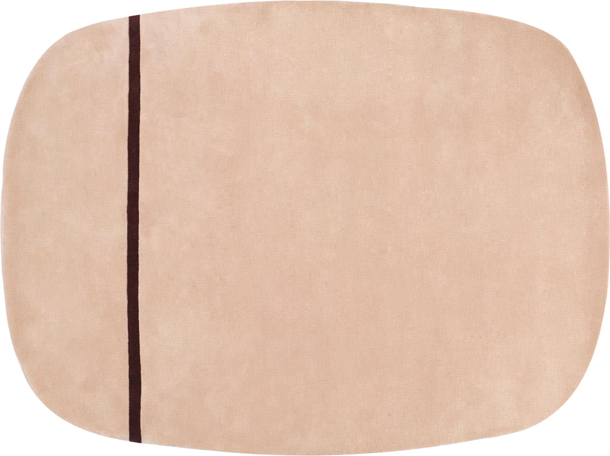 Stilvoller Oona Teppich von Normann Copenhagen, der durch seine harmonischen Farben und hochwertigen Materialien eine gemütliche Atmosphäre schafft.