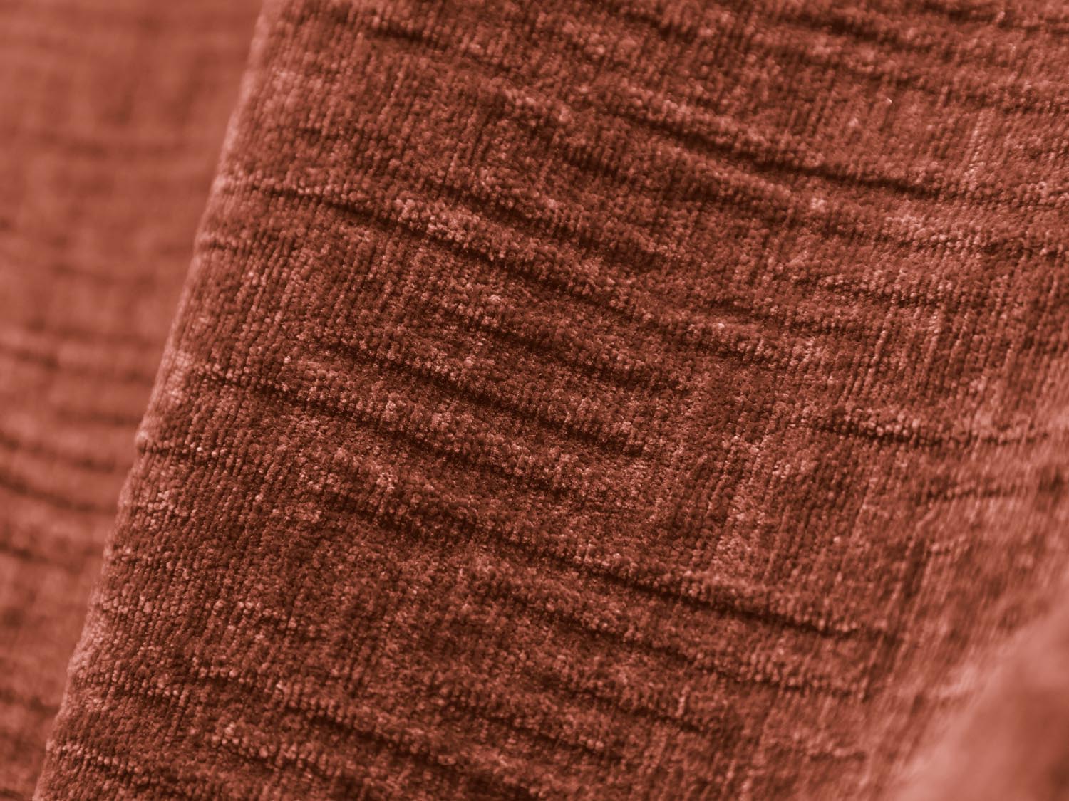 Eleganter Kaelle Sessel in warmem Terracotta, ideal für stilvolle Wohnräume und entspannte Momente. Hochwertige Verarbeitung von Micadoni.