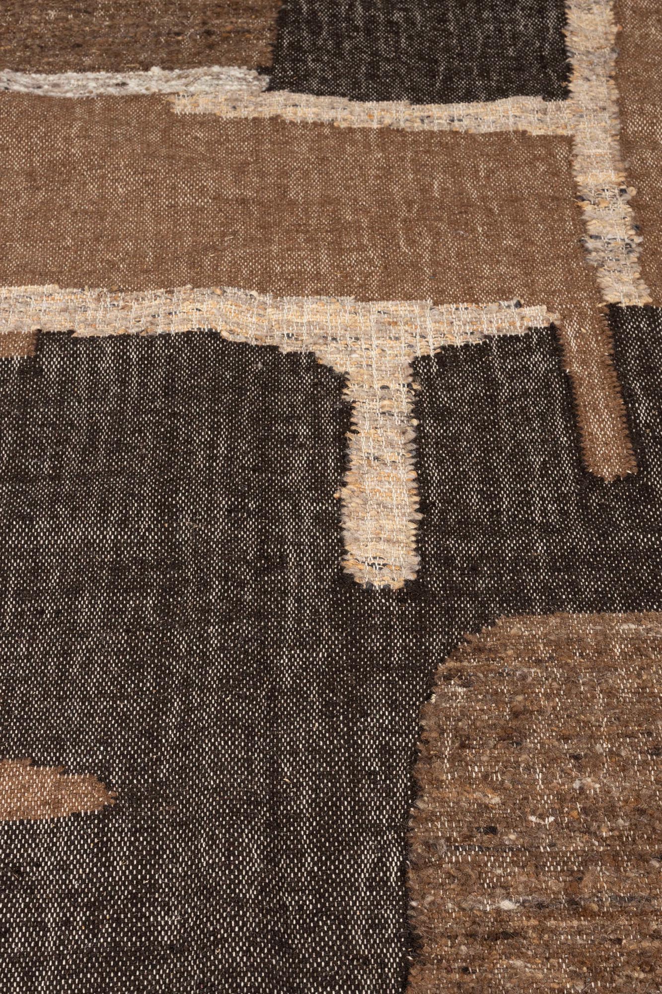 Der Briton Teppich 160x230 von Dutchbone vereint stilvolle Ästhetik mit robustem Material, ideal für jedes Wohnambiente.