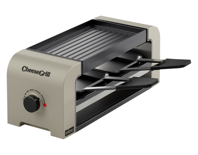 Eleganter STÖCKLI Raclettegrill CheeseGrill 2 in Ivory Gold, ideal für gemütliche Abende mit köstlichem Raclette. Kompakt und stilvoll.