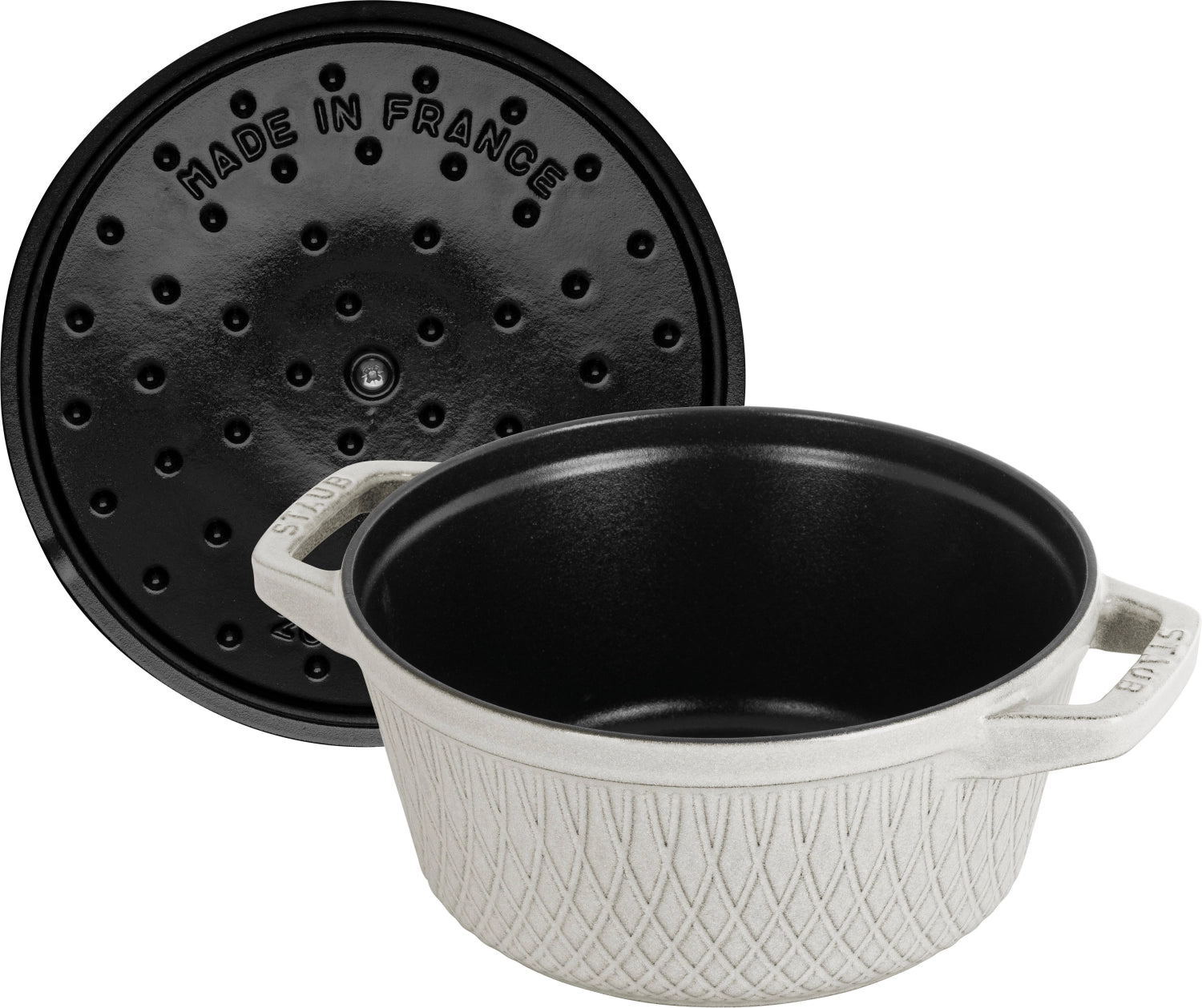 Elegante runde Cocotte von Staub mit 2,29 l Volumen, perfekt für schmackhafte Gerichte und stilvolle Tischpräsentation.