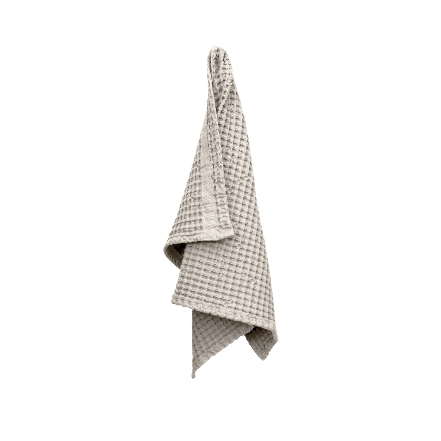 Hochwertiges Big Waffle Handtuch in sanftem Steinfarbton, 50x75 cm, aus 100% Biobaumwolle für nachhaltigen Komfort und Stil.