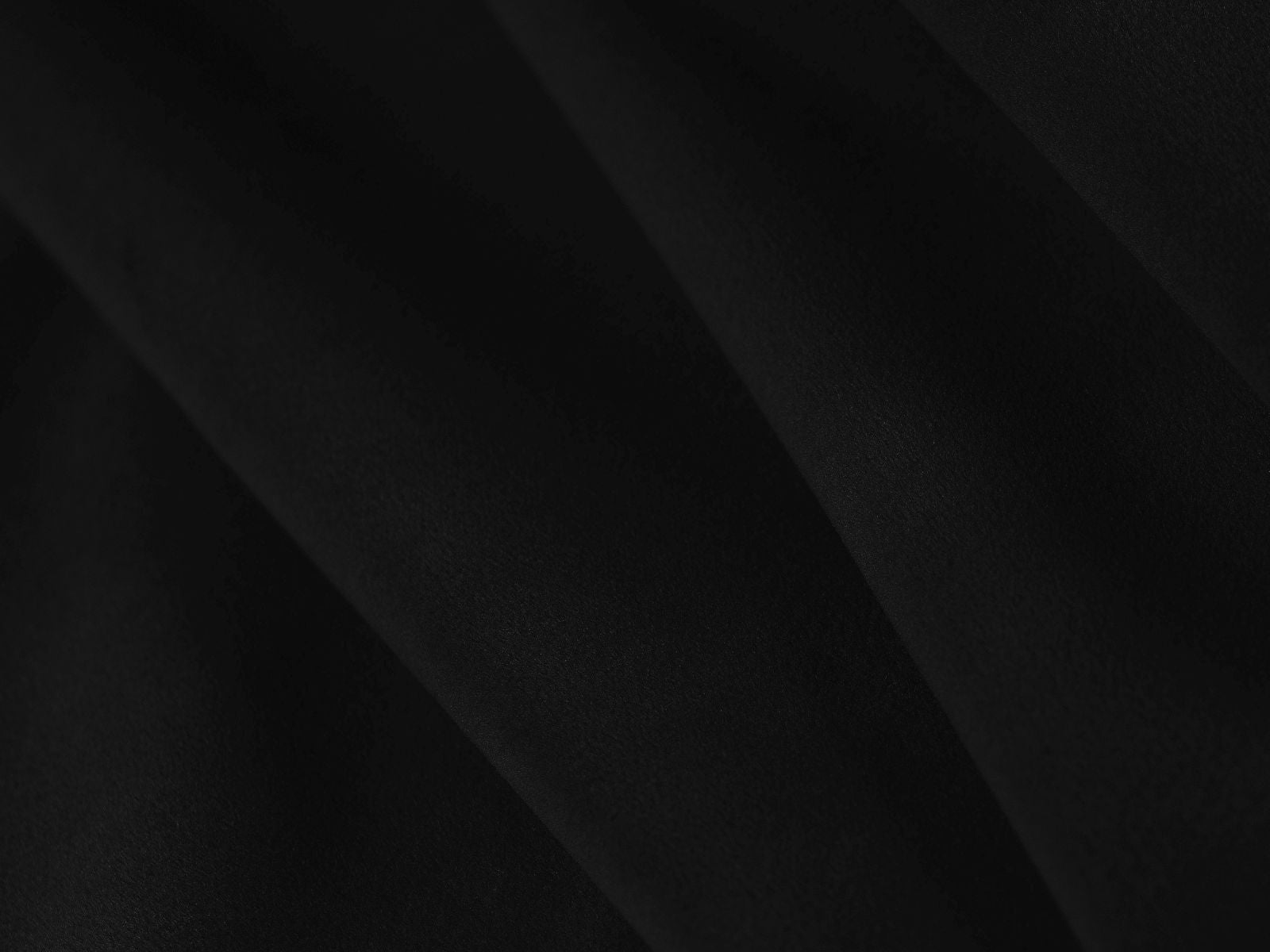 Eleganter 1-Sitzer Pouf Aveiro in modernem Schwarz, ideal für stilvolle Wohnräume und flexible Einsatzmöglichkeiten.