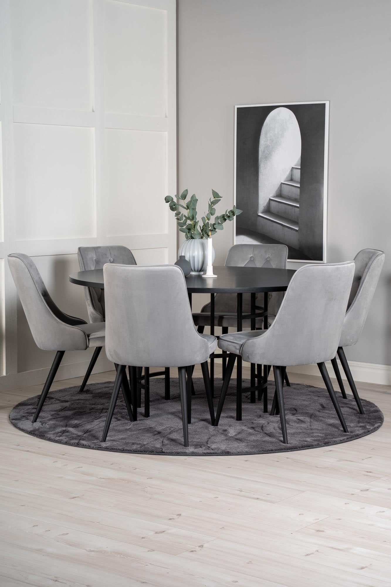 Stilvolles Esszimmerset mit runden Tisch (⌀140cm) und 6 luxuriösen Samtstühlen für unvergessliche Momente und gemütliche Zusammenkünfte.