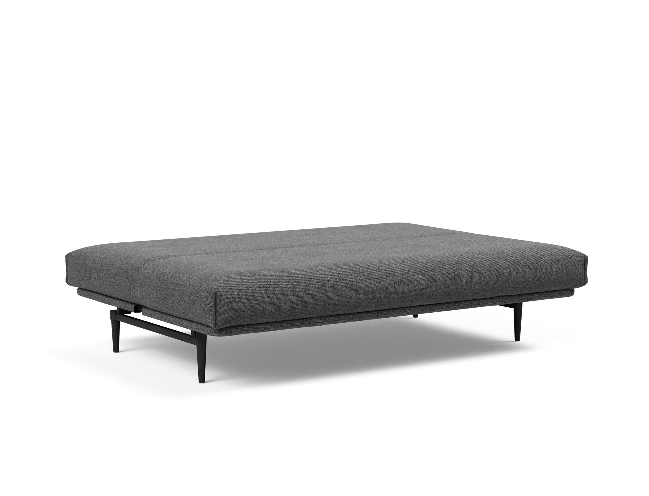 Elegantes Colpus Bettsofa in schwarzer Eiche, kombiniert mit einem komfortablen Soft Spring Bezug für stilvolle Entspannung.
