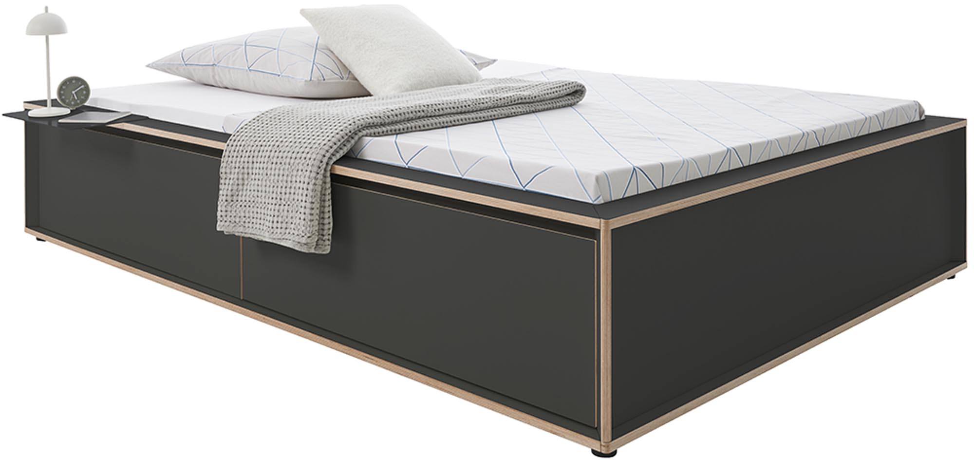 Platzsparendes SPAZE Bett mit Schubladen, perfekt für moderne Räume.