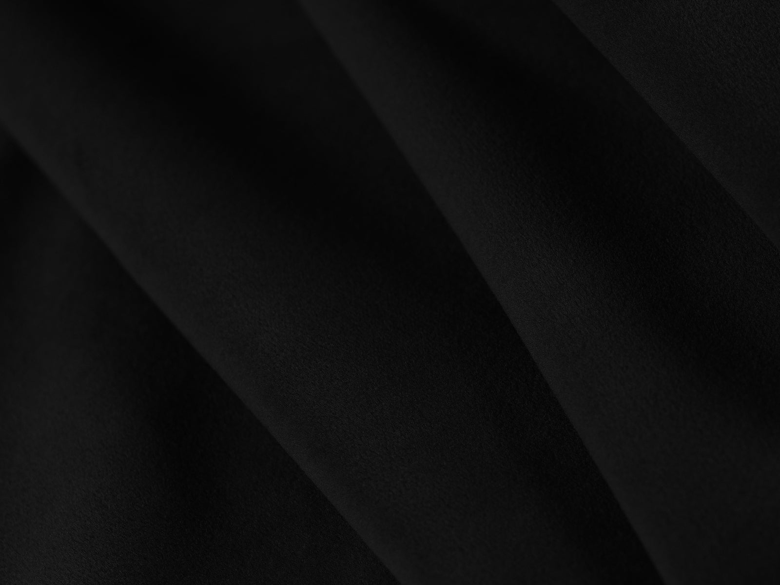 Elegantes Miley Velour Sofa links, 4-Sitzer in hochwertigem Black-Bluvel, ideal für moderne Wohnräume und entspannte Stunden.